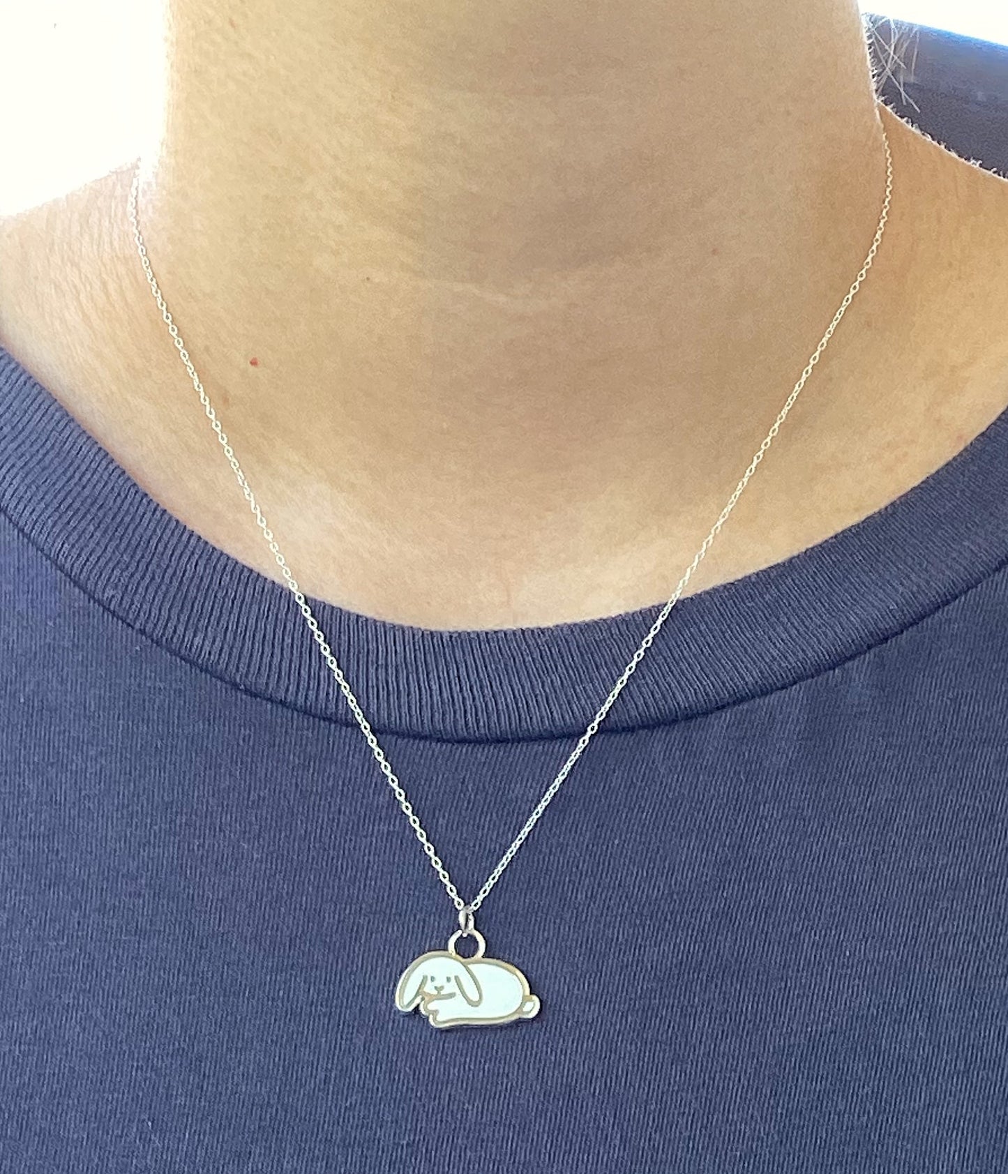 white lop bunny necklace on neck