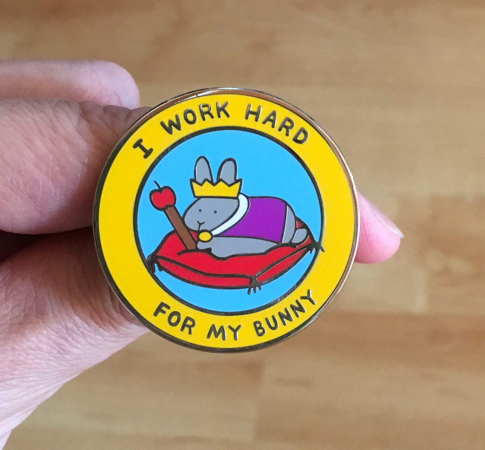 i work hard for my bunny enamel pin in hand